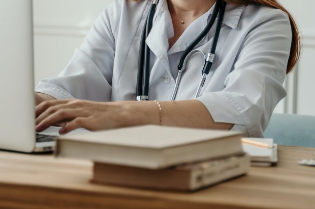 A Doctor Working with a Laptop